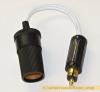 Adaptor plugs into a DIN 12 volt socket  to convert to cigar lighter socket