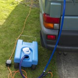 Supply cable and hose connected up - any fresh water container can be used.